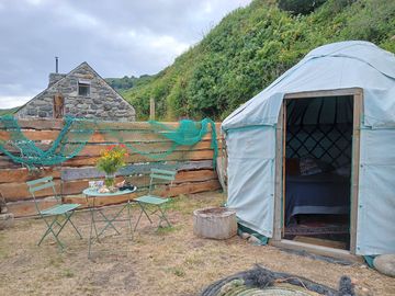 Ger bach & its private outdoor seating area with views of the boat yard & the sea