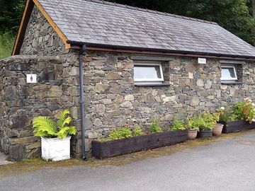 Shower and toilet block with outside tap