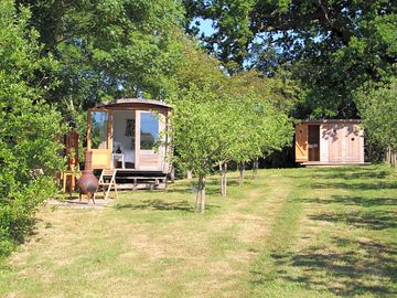 Outdoor dining patio with a washing-up shed