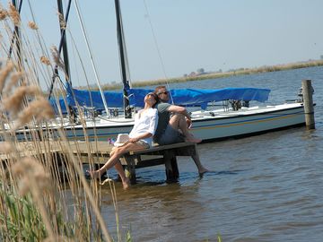 By the water