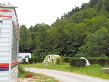 Pitches surrounded by trees and bushes