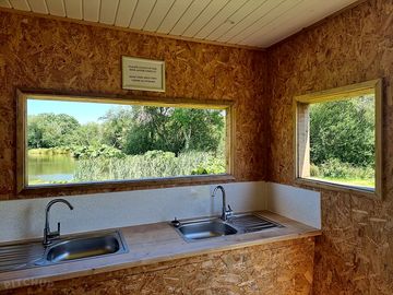 Dish washing by pond meadow