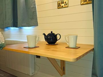 Fold-away dining table