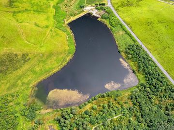 Aerial shot of the lake and pitch from the north-west