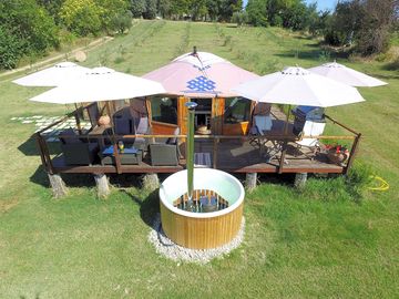 Shaded outdoor deck and hot tub