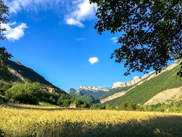 View of the farm surrounded by mountains