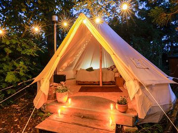 Bell tent with outdoor lighting