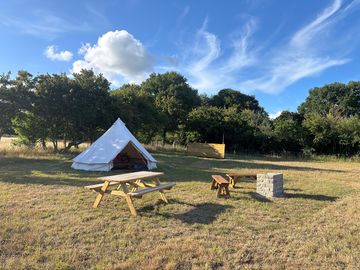 Bell tent with barbecue and picnic table