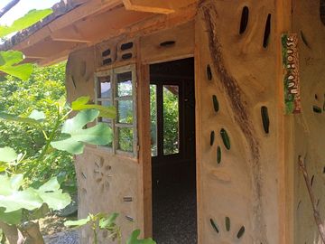 A branch welcoming you to the entrance of the cabin