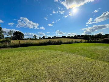 The bottom of the camping field, with views over fields of cows