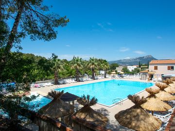 Outdoor pool with sun loungers