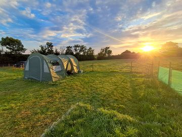 Tent pitch with sunrise