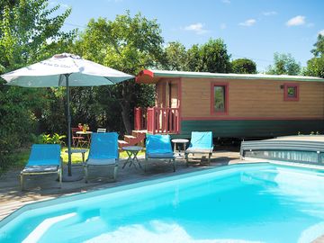 Sunloungers next to the pool