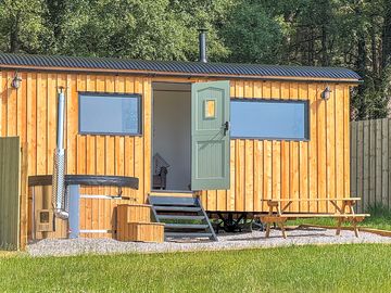 Picnic table and hot tub outside