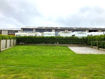 Front view of serviced tent, campervan, motorhome pitch at front and centre of our Meadow