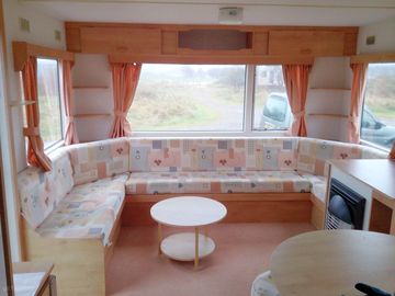 Living room with view of Canna harbour