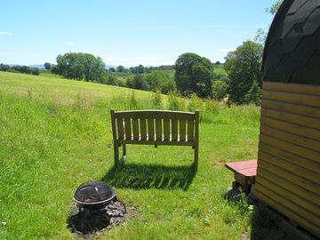 Camping pod with bench and fire bowl
