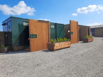 Nicely maintained shower/toilet block area