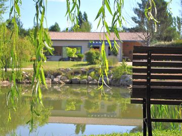 Pond with recreation room behind
