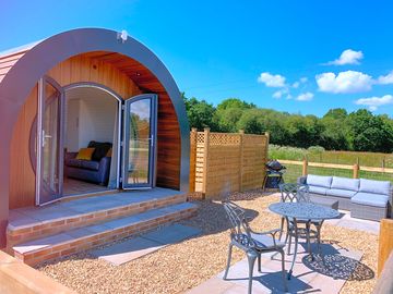 Beautiful secure garden with sofa, BBQ and table & chairs, overlooking the meadow