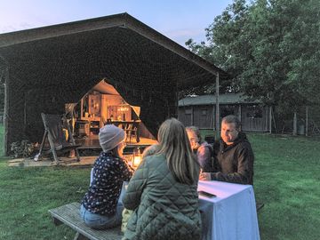 Family outside the tent