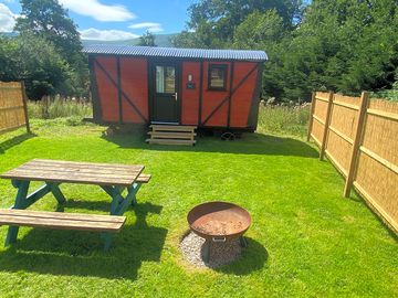 External fire pit and picnic bench.