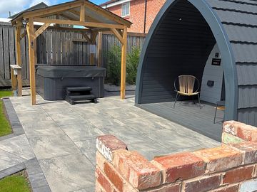 Outdoor space with hot tub