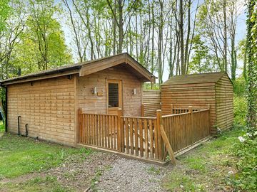 Dog friendly lodge exterior with fence