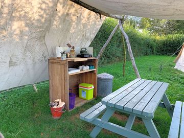 Camp kitchen and picnic bench