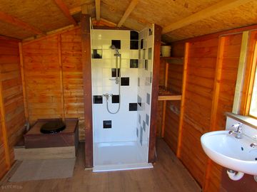 The cabin with shower, loo and basin