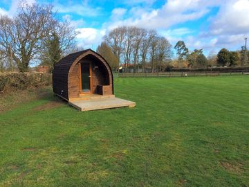 Covered seating area outside the pod