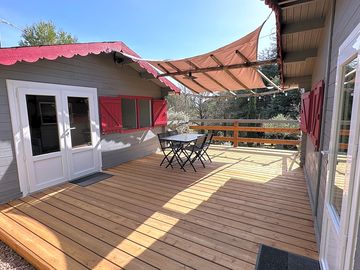 Lodge terrace shaded by an awning