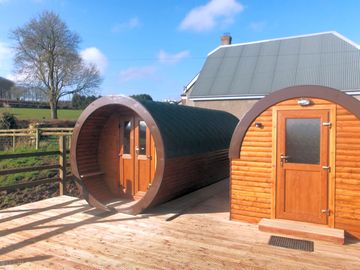 Microlodge to the left, with the private ensuite bathroom pod to the right