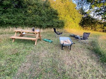 Relaxing around the fire by the yurt