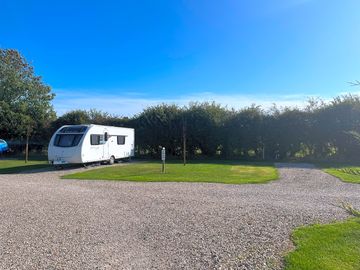 Fully seviced grass and gravel pitch