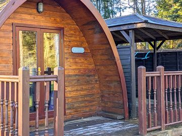 Entrance to a wooden mega pod