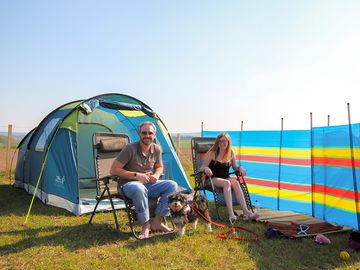 A couple and their lovely dog pepper enjoying a weekend in the sun in our large camping field