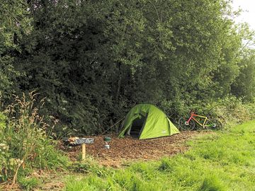 Sheltered tent pitch