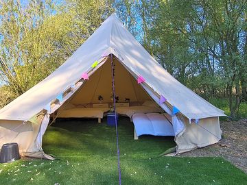 7 metre bell tent, sleeps up to 10 people. Two barbecues, picnic bench and firepit included
