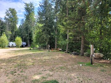 Full service tent site with 15 amp power, water, picnic table, and firepit