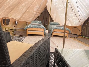 Bell tent set up with two single beds
