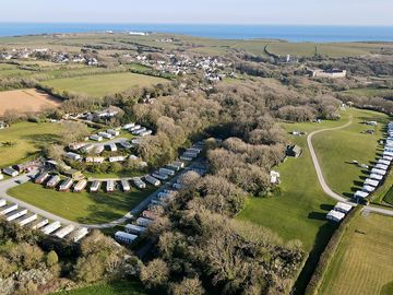 Aerial view of the site, the village and the castle