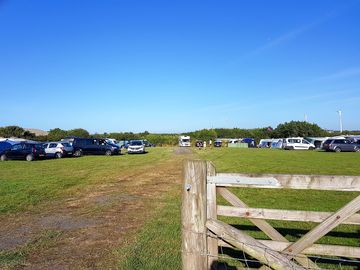 Large camping field with space for parking and playing