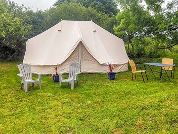 Bell tent with outdoor chairs
