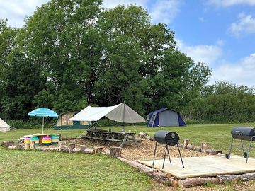 Communal barbecue area with covered seating