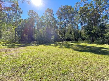 Dam-side hollow campsite
