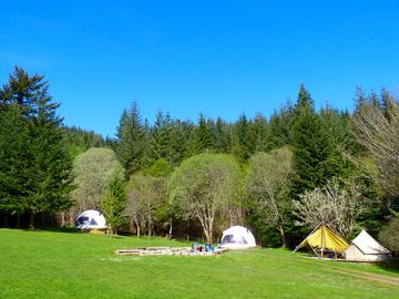 The glamping area, alongside the central seating and firepit area