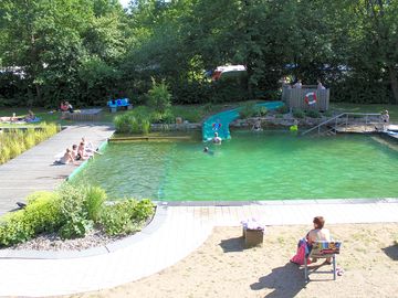 Swimming pool with slide and sun terrace