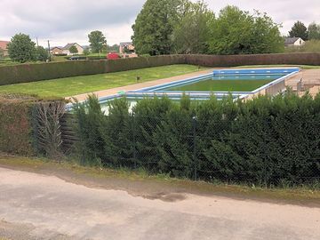 Swimming pool available in luzy fairly close to the campsite