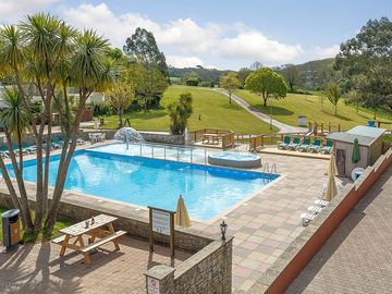 Heated outdoor pool with mini splash pad and poolside spa